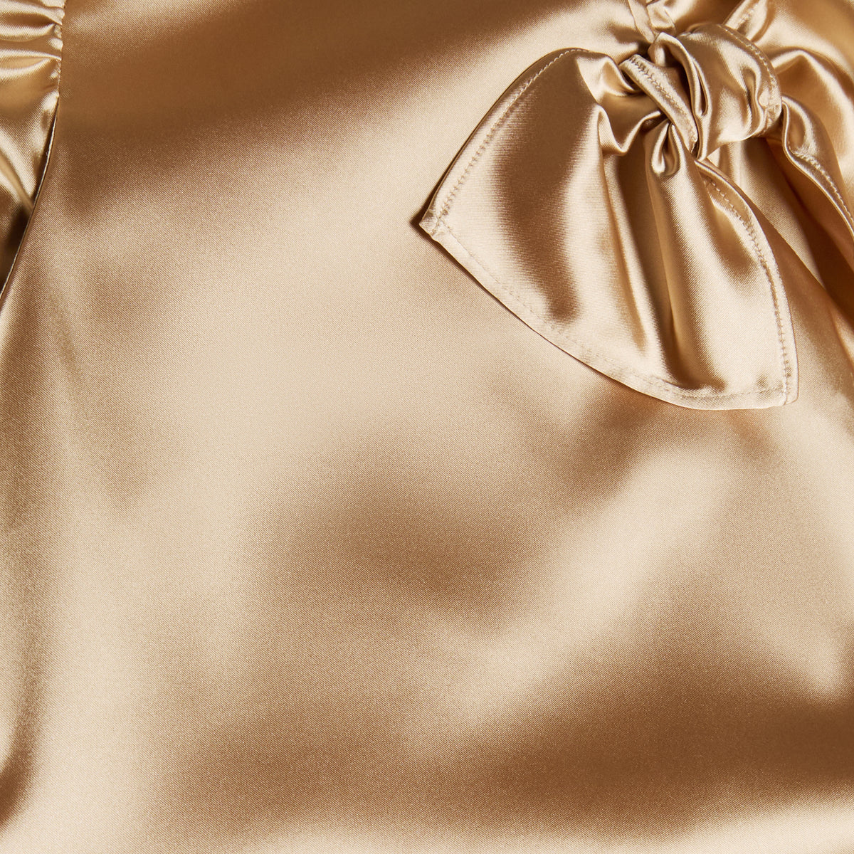 Champagne stretch duchesse midi dress with a ruched bodice and shoulder pads, featuring a bow detail and pockets.

Look 6 – Spring Summer 2027 Lookbook