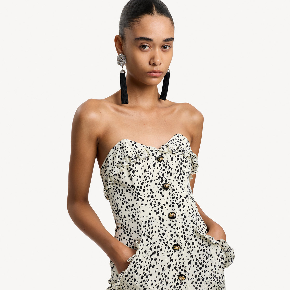 Ivory and black animalier print silk crêpe de chine mini dress with a bustier, featuring ruffle trims and back-zip closure. Finished with pockets and jewel buttons.

Look 13 – Spring Summer 2027 Lookbook