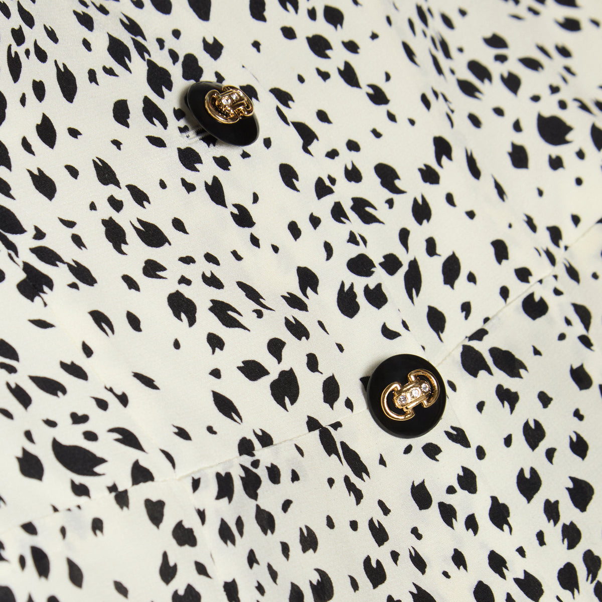 Ivory and black animalier print silk crêpe de chine mini dress with a bustier, featuring ruffle trims and back-zip closure. Finished with pockets and jewel buttons.

Look 13 – Spring Summer 2027 Lookbook