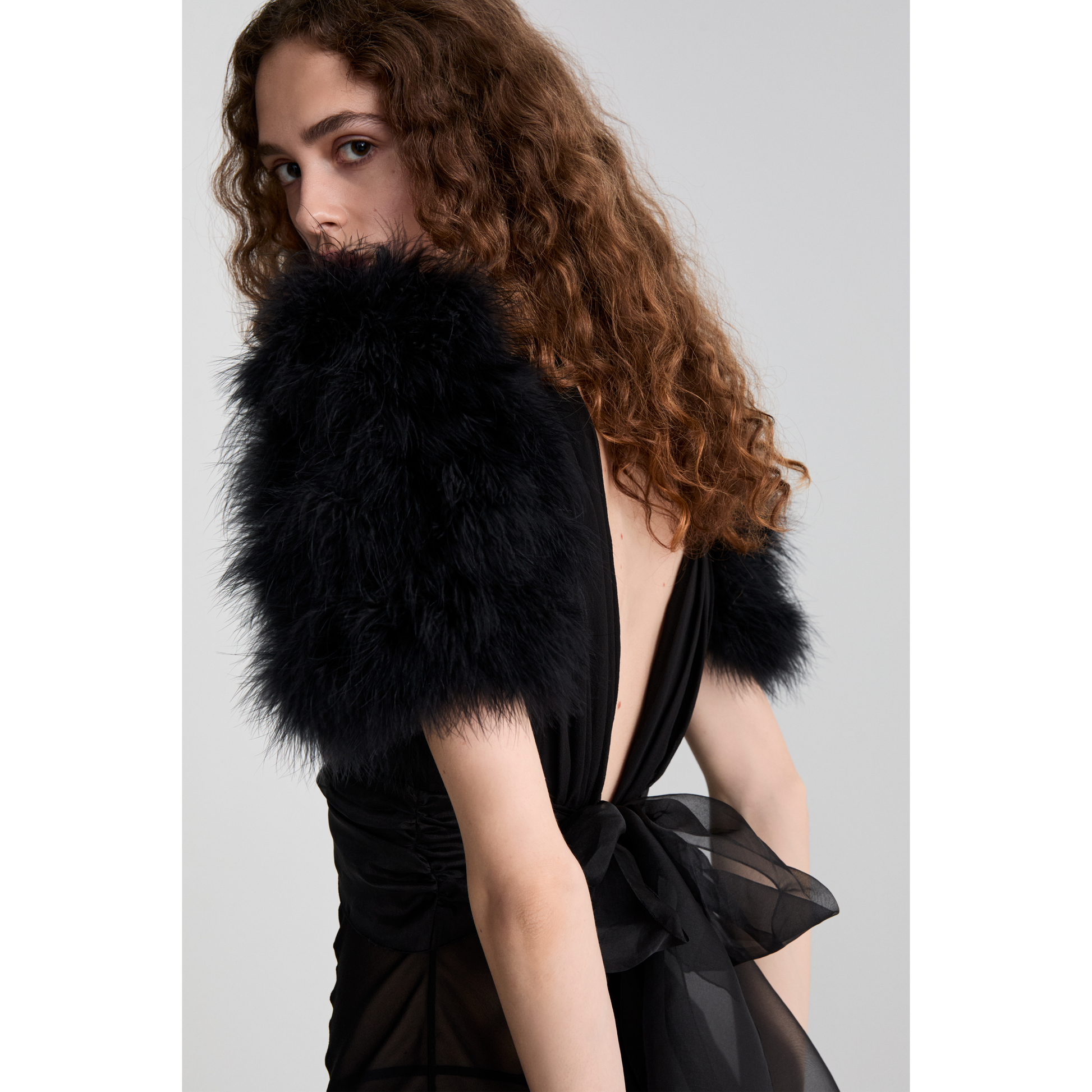 Black silk georgette slip evening dress with a deep v-neckline and short sleeves, featuring feather-trimmed shoulders.

Look 15 – Spring Summer 26 Lookbook